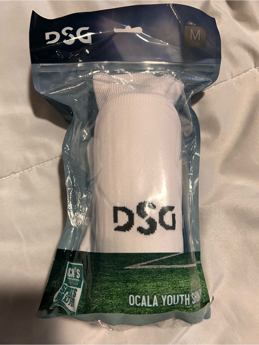 DSG White Youth shin socks with Black Logo